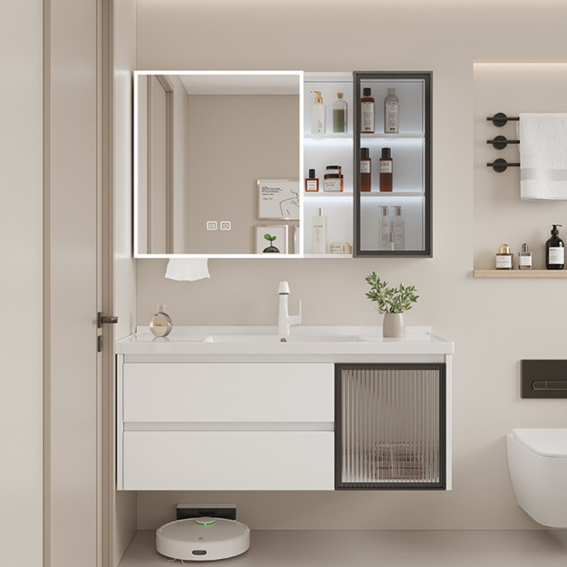 Contemporary bathroom vanity with illuminated mirror cabinet and sink, stylish shelving, and minimalist decor.