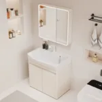 Stylish bathroom vanity with LED-lit mirror cabinet, sink, and shelving displaying toiletries in a contemporary setting.