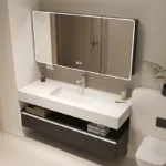 Contemporary bathroom vanity with a large illuminated mirror, integrated sink, and storage drawers beneath. Stylish bathroom setup.