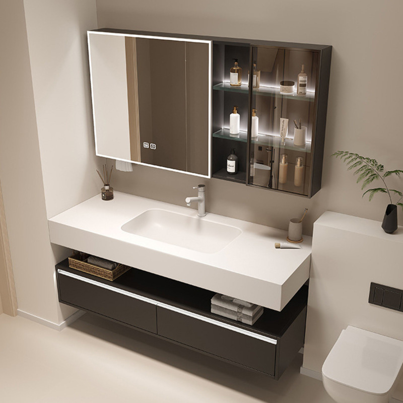 Contemporary bathroom vanity featuring a white basin and dark cabinetry with a mirrored cabinet and open shelves holding toiletries.