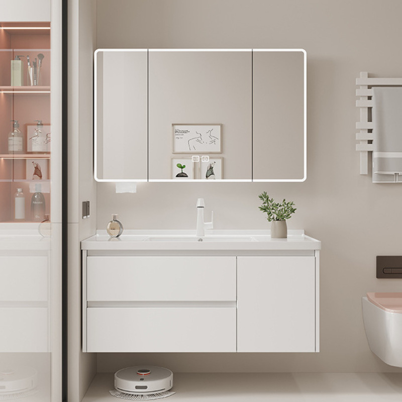 Contemporary bathroom setting featuring a white vanity unit with an illuminated mirror, decorative items, and stylish shelving.