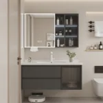 Modern bathroom featuring a sleek vanity with storage alongside a mirrored cabinet and shelves adorned with toiletries and decor.