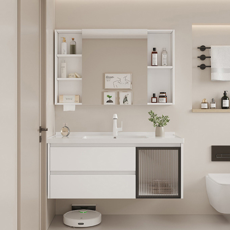 Contemporary bathroom featuring a sleek white vanity with integrated sink, mirror cabinet, shelves with toiletries, and decorative items.