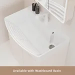 White bathroom vanity with a washboard basin and built-in faucet, accompanied by two black soap dispensers.