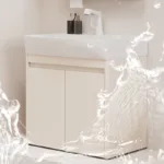 White bathroom vanity with sleek faucet and water splash effect, showcasing modern design and functionality in a neutral setting.