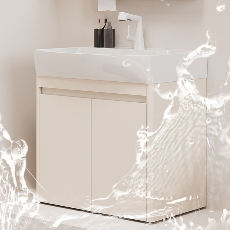 White bathroom vanity with sleek faucet and water splash effect, showcasing modern design and functionality in a neutral setting.